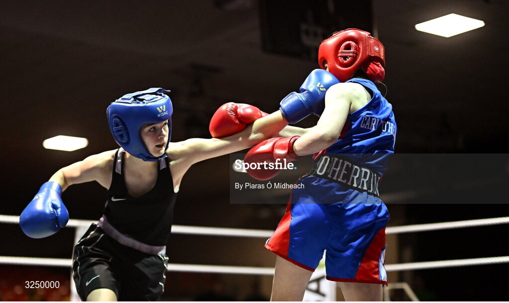 19 September 2025; Aleigha Murphy of Ballybrack BC Dublin, left, in action against Carly O’Herron of Rochfordbridge BC Westmeath during their 52kg bout at the 2025 IABA National U17 Championship Finals at the National Boxing Stadium in Dublin. Photo by Piaras Ó Mídheach/Sportsfile