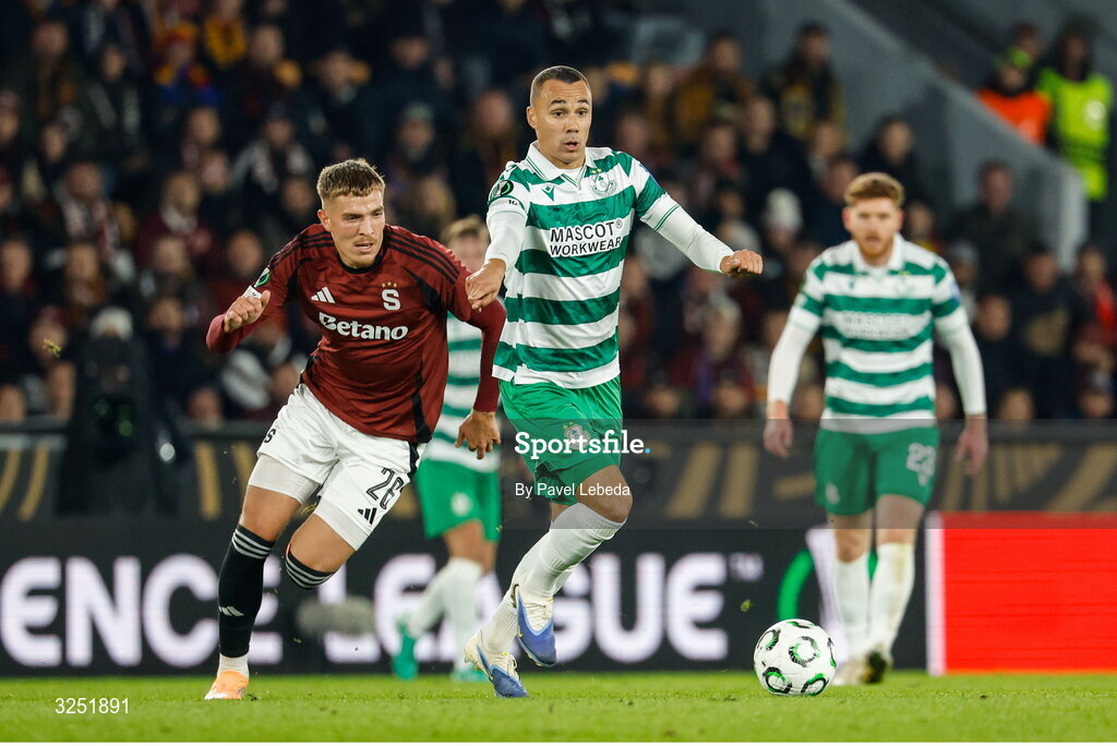 2 October 2025; Graham Burke of Shamrock Rovers, right, in action against Patrik Vydra during the UEFA Conference League 2025/26 league phase match between Sparta Praha and Shamrock Rovers at epet ARENA in Prague, Czechia. Photo by Pavel Lebeda/Sportsfile
