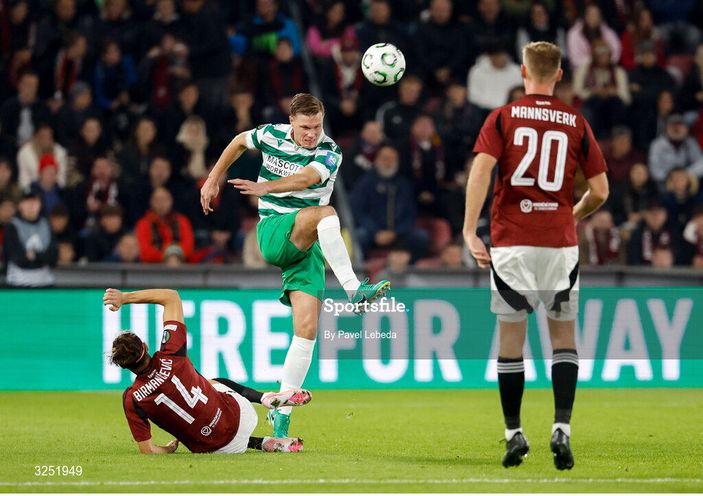 2 October 2025; Daniel Cleary of Shamrock Rovers in action against Veljko Birmancevic, left, and Sivert Mannsverk of Sparta Praha during the UEFA Conference League 2025/26 league phase match between Sparta Praha and Shamrock Rovers at epet ARENA in Prague, Czechia. Photo by Pavel Lebeda/Sportsfile