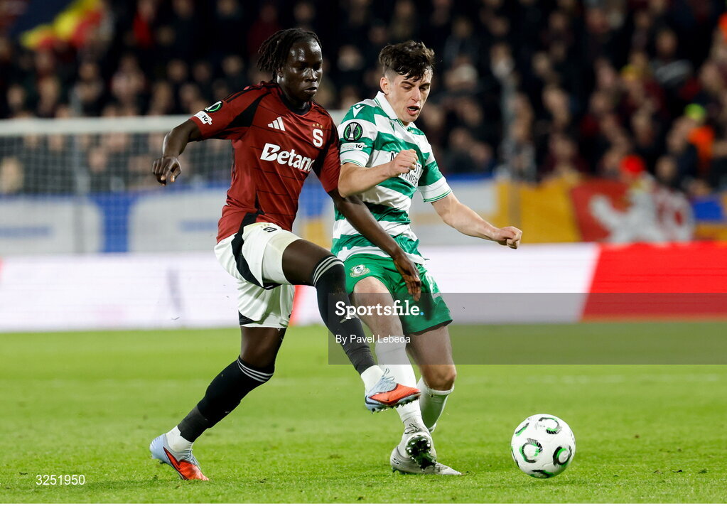 2 October 2025; Cory O'Sullivan of Shamrock Rovers in action against Garang Kuol of Sparta Praha during the UEFA Conference League 2025/26 league phase match between Sparta Praha and Shamrock Rovers at epet ARENA in Prague, Czechia. Photo by Pavel Lebeda/Sportsfile