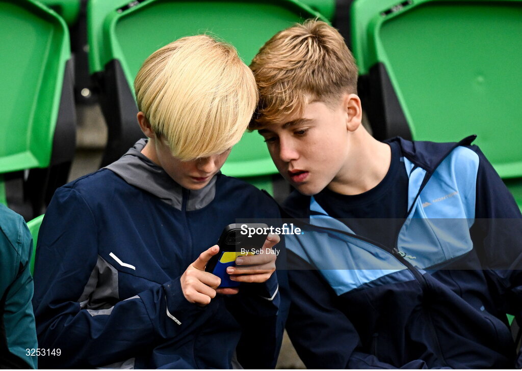5 October 2025; Shamrock Rovers supporters look at their mobile phones before the Sports Direct Men’s FAI Cup semi-final match between Shamrock Rovers and Kerry FC at Tallaght Stadium in Dublin. Photo by Seb Daly/Sportsfile