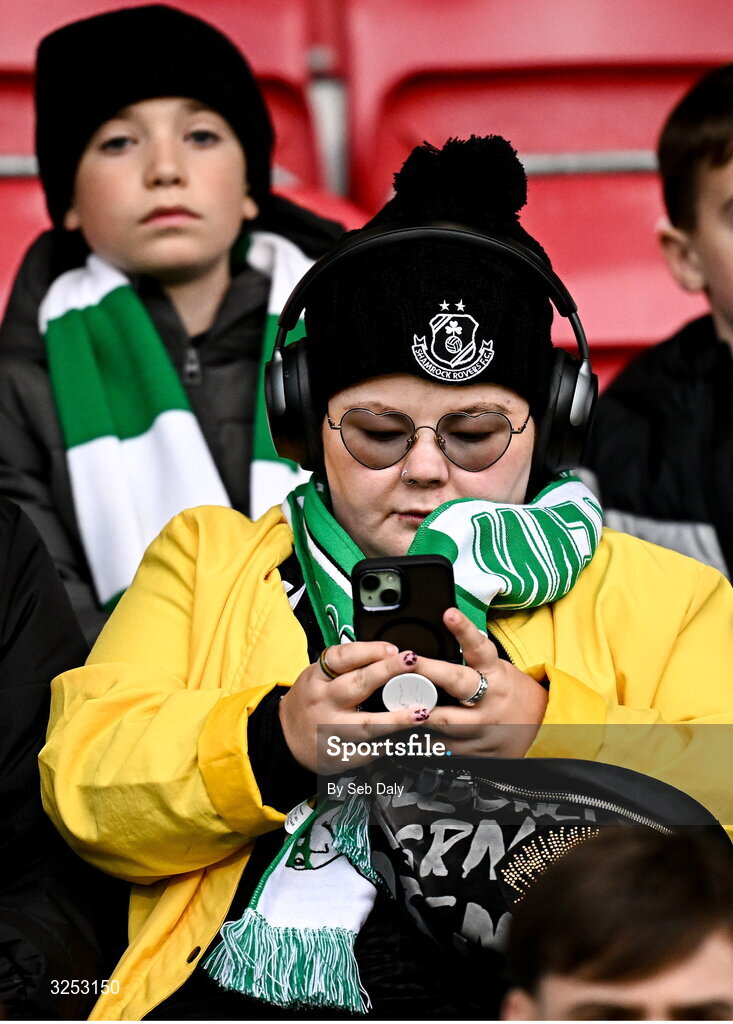 5 October 2025; Shamrock Rovers supporters look at their mobile phones before the Sports Direct Men’s FAI Cup semi-final match between Shamrock Rovers and Kerry FC at Tallaght Stadium in Dublin. Photo by Seb Daly/Sportsfile