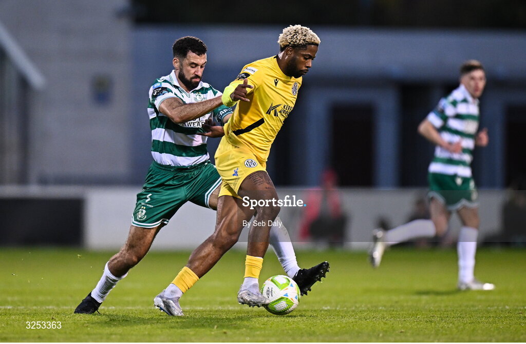 5 October 2025; Daniel Okwute of Kerry FC in action against Graham Burke of Shamrock Rovers during the Sports Direct Men’s FAI Cup semi-final match between Shamrock Rovers and Kerry FC at Tallaght Stadium in Dublin. Photo by Seb Daly/Sportsfile