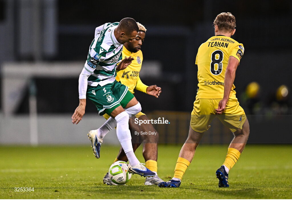 5 October 2025; Graham Burke of Shamrock Rovers in action against Kerry FC players Daniel Okwute, behind, and Ronan Teahan, right, during the Sports Direct Men’s FAI Cup semi-final match between Shamrock Rovers and Kerry FC at Tallaght Stadium in Dublin. Photo by Seb Daly/Sportsfile