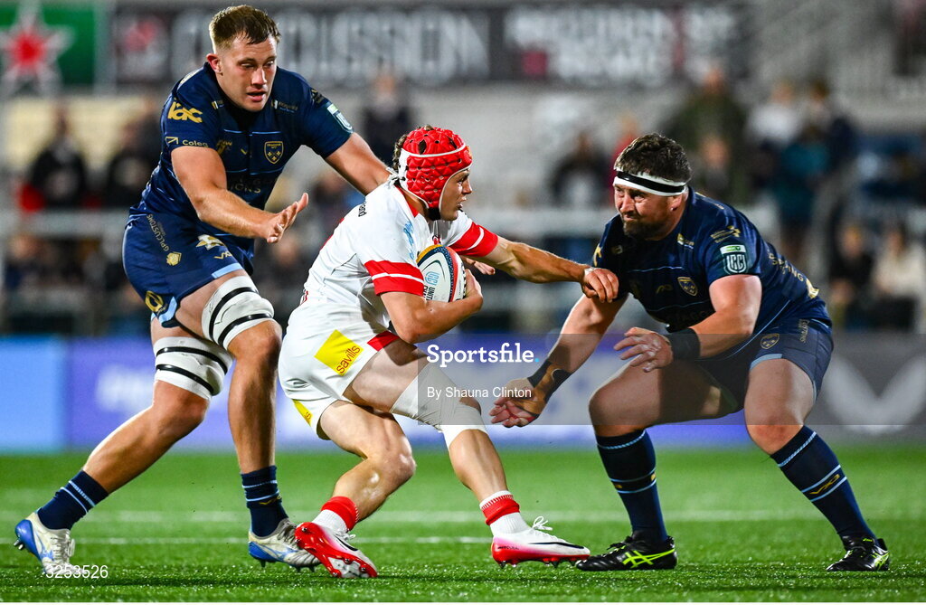 26 September 2025; Michael Lowry of Ulster is tackled by Dragons players Ben Carter, left, and Wyn Jones during the United Rugby Championship match between Ulster and Dragons at Affidea Stadium in Belfast. Photo by Shauna Clinton/Sportsfile
