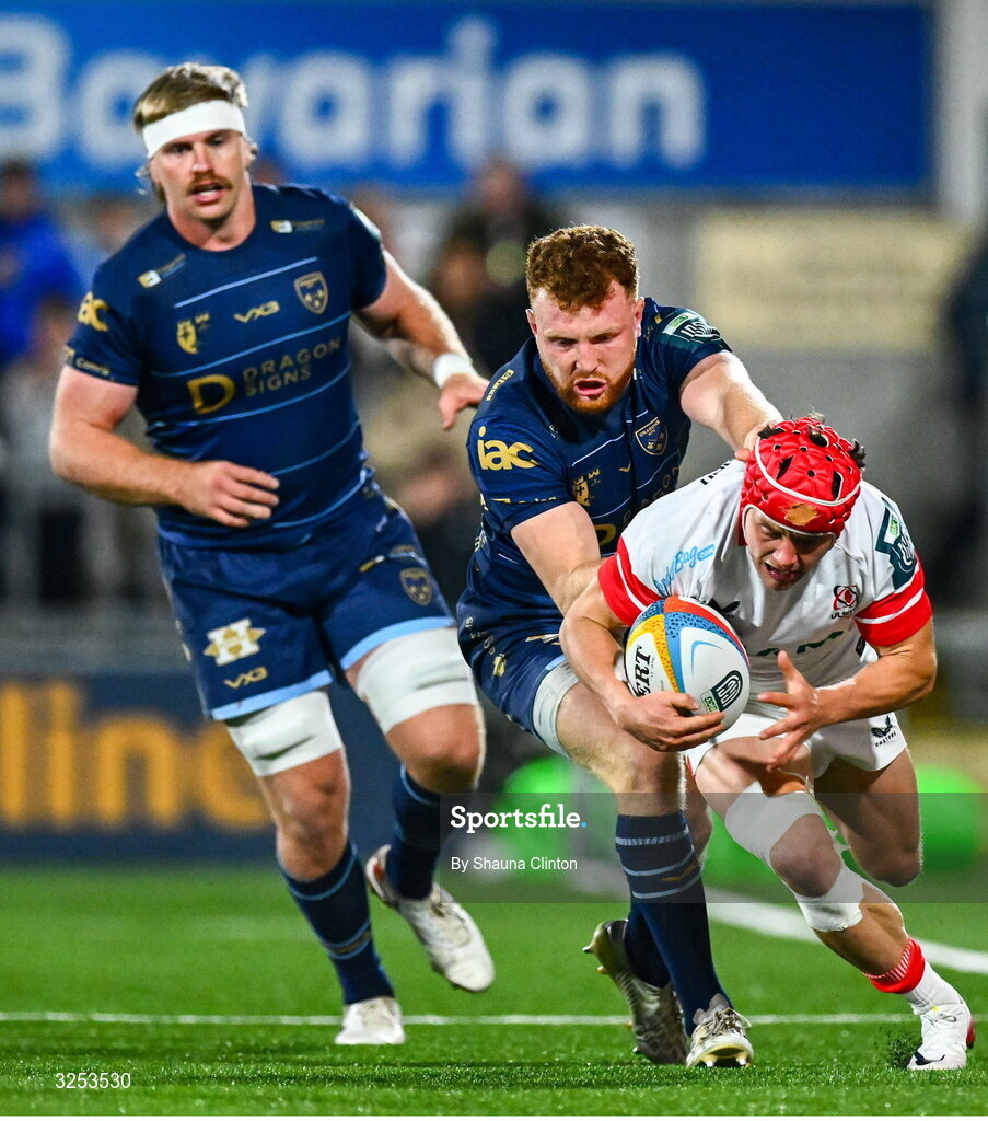 26 September 2025; Michael Lowry of Ulster is tackled by Aneurin Owen of Dragons during the United Rugby Championship match between Ulster and Dragons at Affidea Stadium in Belfast. Photo by Shauna Clinton/Sportsfile