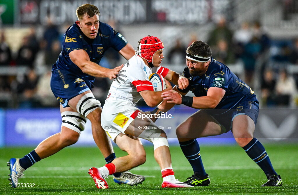 26 September 2025; Michael Lowry of Ulster is tackled by Dragons players Ben Carter, left, and Wyn Jones during the United Rugby Championship match between Ulster and Dragons at Affidea Stadium in Belfast. Photo by Shauna Clinton/Sportsfile