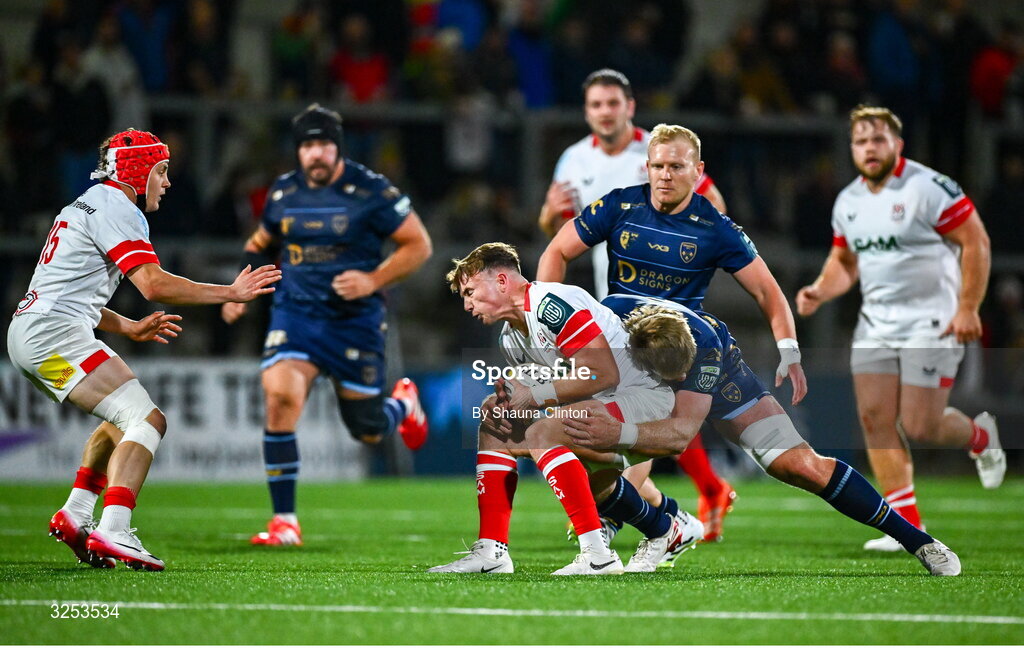 26 September 2025; Jack Murphy of Ulster is tackled by Aaron Wainwright of Dragons during the United Rugby Championship match between Ulster and Dragons at Affidea Stadium in Belfast. Photo by Shauna Clinton/Sportsfile