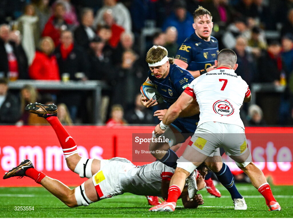 26 September 2025; Aaron Wainwright of Dragons in action against Tom Stewart, left, and Nick Timoney of Ulster during the United Rugby Championship match between Ulster and Dragons at Affidea Stadium in Belfast. Photo by Shauna Clinton/Sportsfile