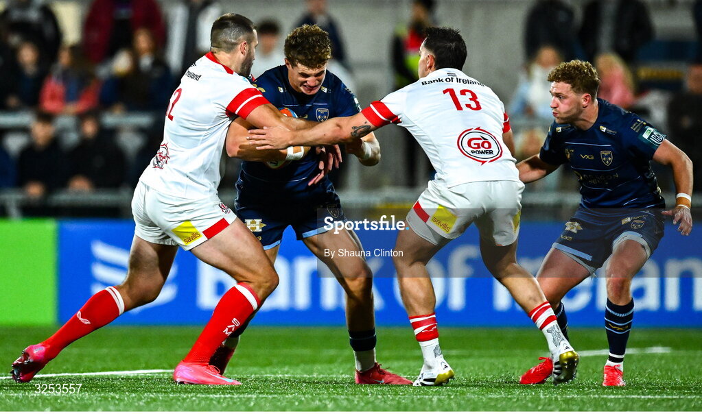 26 September 2025; Joe Westwood of Dragons in action against Stuart McCloskey, left, and James Hume of Ulster during the United Rugby Championship match between Ulster and Dragons at Affidea Stadium in Belfast. Photo by Shauna Clinton/Sportsfile