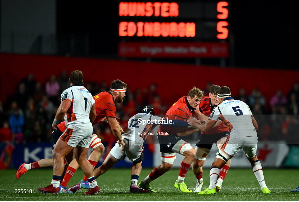 10 October 2025; Gavin Coombes of Munster is tackled by Edinburgh players James Lang, left, and Sam Skinner during the United Rugby Championship match between Munster and Edinburgh at Virgin Media Park in Cork. Photo by Shauna Clinton/Sportsfile