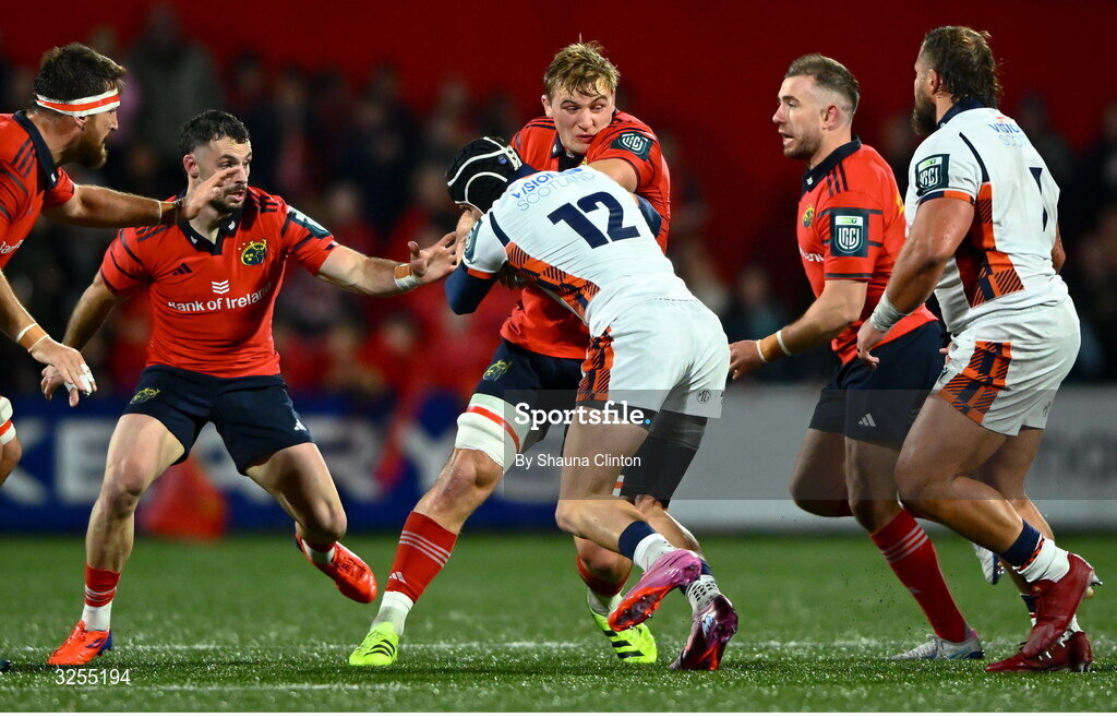 10 October 2025; Gavin Coombes of Munster is tackled by James Lang of Edinburgh during the United Rugby Championship match between Munster and Edinburgh at Virgin Media Park in Cork. Photo by Shauna Clinton/Sportsfile