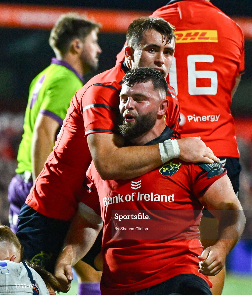 10 October 2025; Michael Milne of Munster, centre, celebrates after scoring his side's third try during the United Rugby Championship match between Munster and Edinburgh at Virgin Media Park in Cork. Photo by Shauna Clinton/Sportsfile