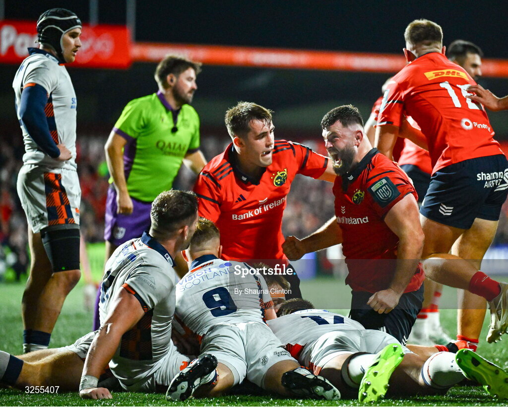 10 October 2025; Michael Milne of Munster, centre, celebrates after scoring his side's third try during the United Rugby Championship match between Munster and Edinburgh at Virgin Media Park in Cork. Photo by Shauna Clinton/Sportsfile