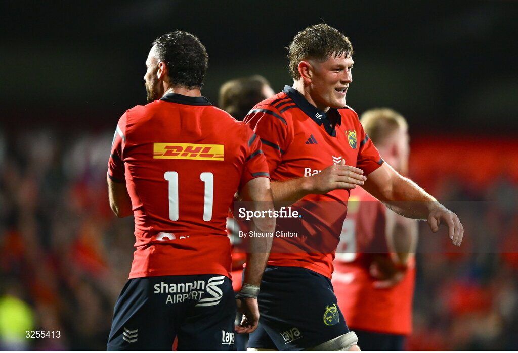 10 October 2025; Jack O'Donoghue of Munster, right, celebrates with team-mate Andrew Smith during the United Rugby Championship match between Munster and Edinburgh at Virgin Media Park in Cork. Photo by Shauna Clinton/Sportsfile