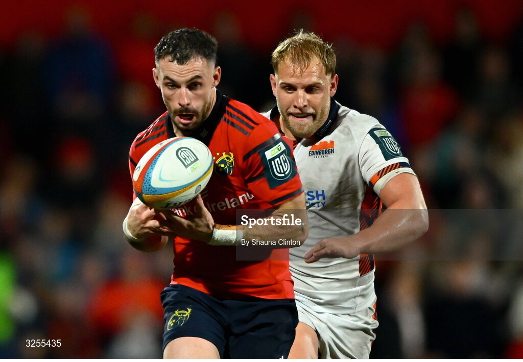 10 October 2025; Andrew Smith of Munster is chased down by Dylan Richardson of Edinburgh during the United Rugby Championship match between Munster and Edinburgh at Virgin Media Park in Cork. Photo by Shauna Clinton/Sportsfile