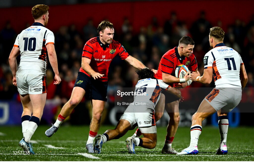 10 October 2025; Calvin Nash of Munster in action against Edinburgh players Wes Goosen, left, and Duhan van der Merwe during the United Rugby Championship match between Munster and Edinburgh at Virgin Media Park in Cork. Photo by Shauna Clinton/Sportsfile