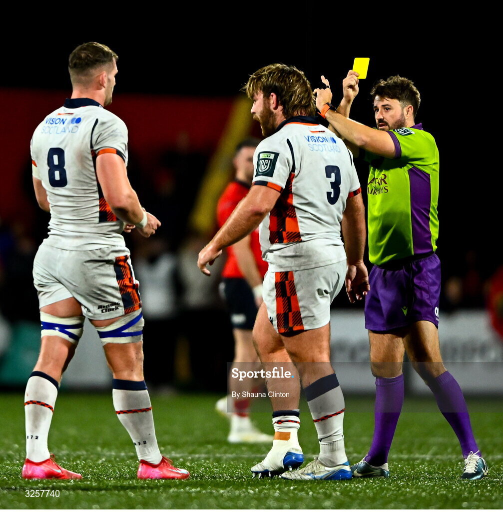 10 October 2025; Referee Ben Whitehouse shows a yellow card to D'arcy Rae of Edinburgh during the United Rugby Championship match between Munster and Edinburgh at Virgin Media Park in Cork. Photo by Shauna Clinton/Sportsfile