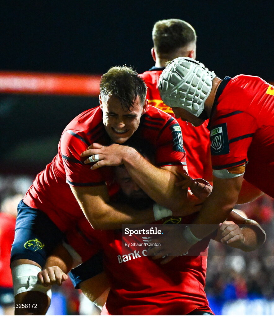 10 October 2025; Michael Milne of Munster, centre, celebrates after scoring his side's third try during the United Rugby Championship match between Munster and Edinburgh at Virgin Media Park in Cork. Photo by Shauna Clinton/Sportsfile