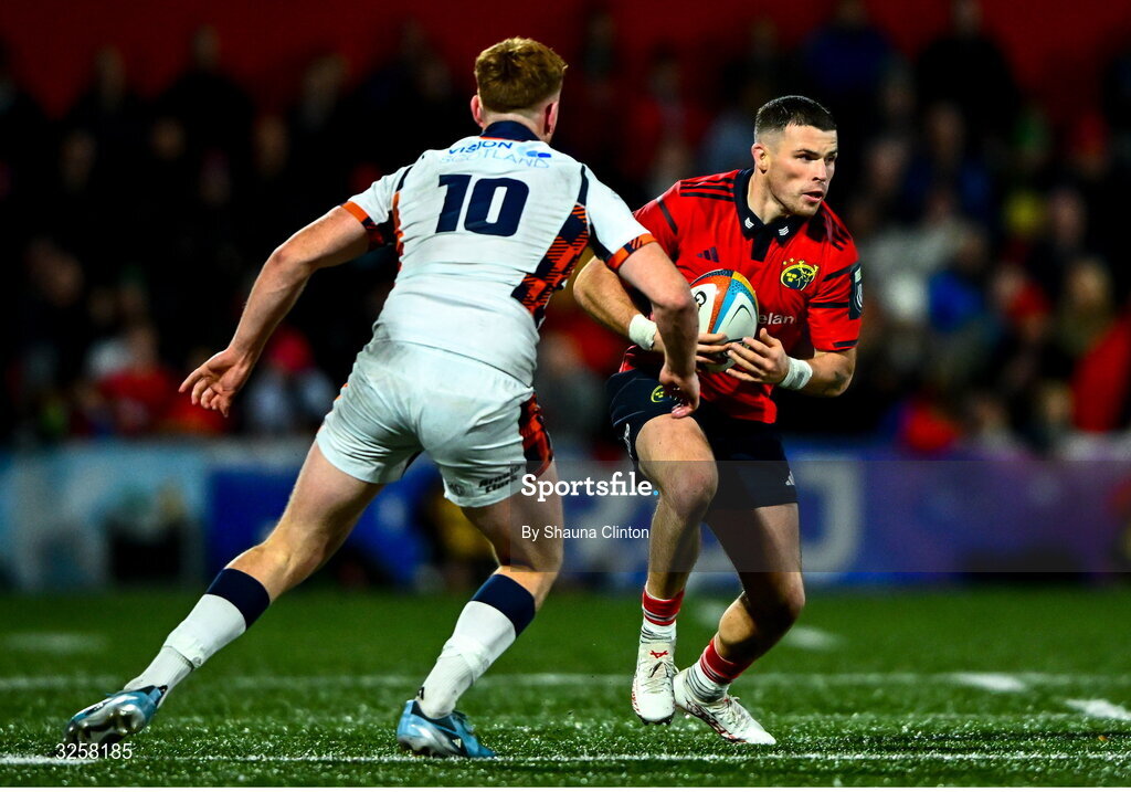 10 October 2025; Calvin Nash of Munster in action against Ben Healy of Edinburgh during the United Rugby Championship match between Munster and Edinburgh at Virgin Media Park in Cork. Photo by Shauna Clinton/Sportsfile