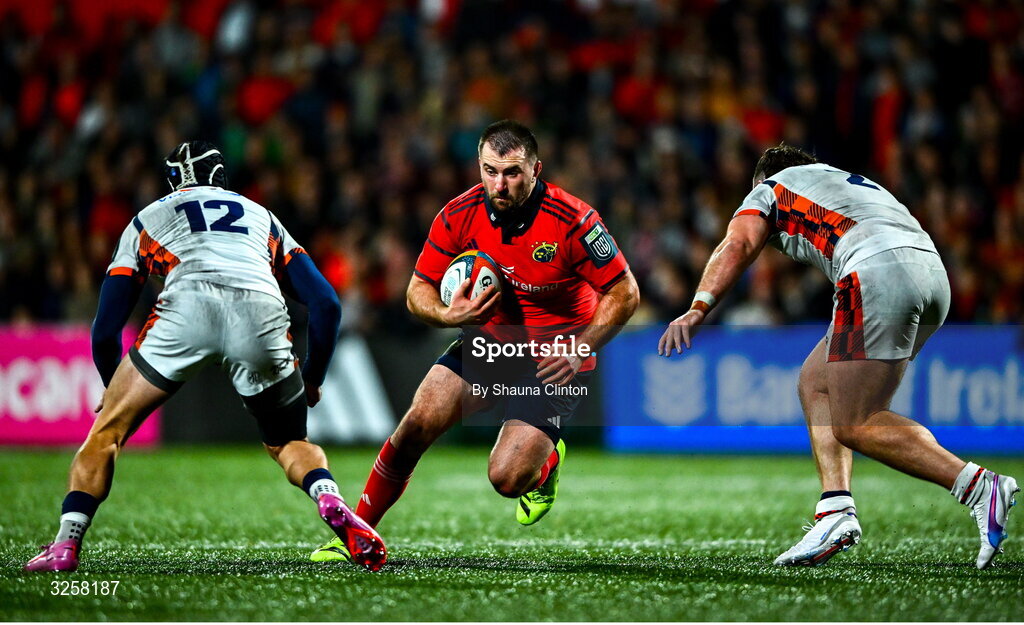 10 October 2025; Diarmuid Barron of Munster in action against Edinburgh players James Lang, left, and Ewan Ashman during the United Rugby Championship match between Munster and Edinburgh at Virgin Media Park in Cork. Photo by Shauna Clinton/Sportsfile