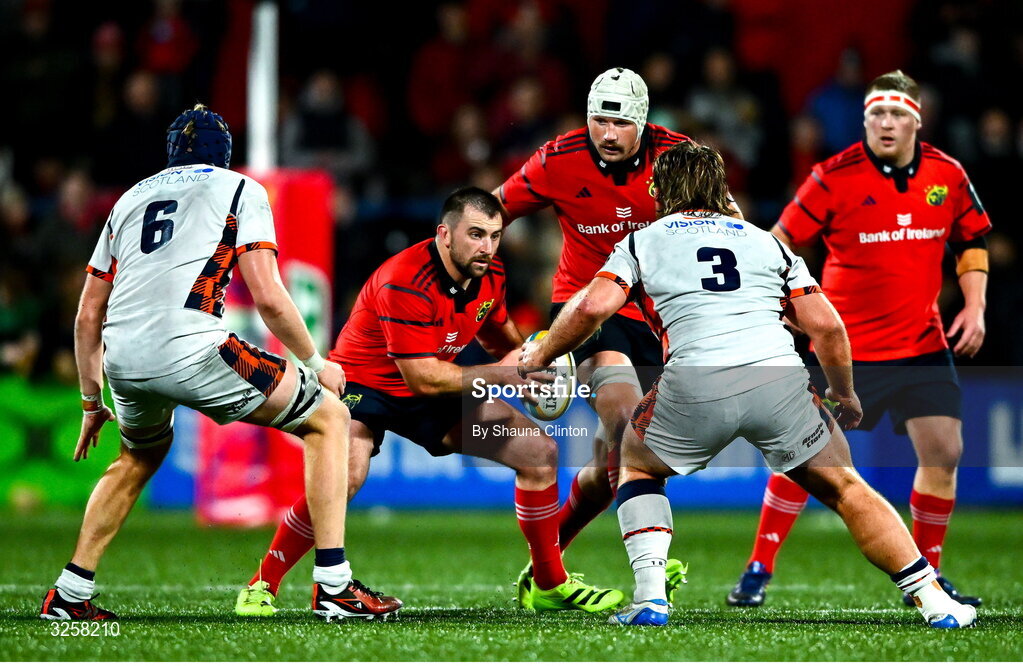 10 October 2025; Diarmuid Barron of Munster in action against Edinburgh players Liam McConnell, left, and D'arcy Rae during the United Rugby Championship match between Munster and Edinburgh at Virgin Media Park in Cork. Photo by Shauna Clinton/Sportsfile