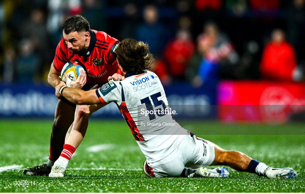 10 October 2025; Andrew Smith of Munster evades the tackle of Wes Goosen of Edinburgh during the United Rugby Championship match between Munster and Edinburgh at Virgin Media Park in Cork. Photo by Shauna Clinton/Sportsfile