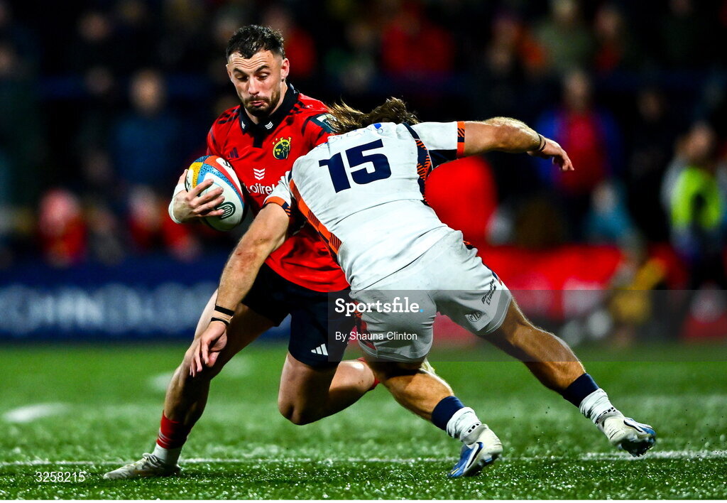 10 October 2025; Andrew Smith of Munster evades the tackle of Wes Goosen of Edinburgh during the United Rugby Championship match between Munster and Edinburgh at Virgin Media Park in Cork. Photo by Shauna Clinton/Sportsfile