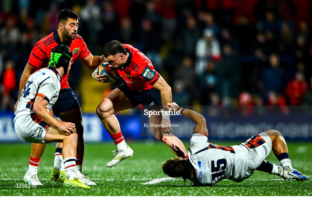 10 October 2025; Andrew Smith of Munster evades the tackle of Wes Goosen of Edinburgh during the United Rugby Championship match between Munster and Edinburgh at Virgin Media Park in Cork. Photo by Shauna Clinton/Sportsfile
