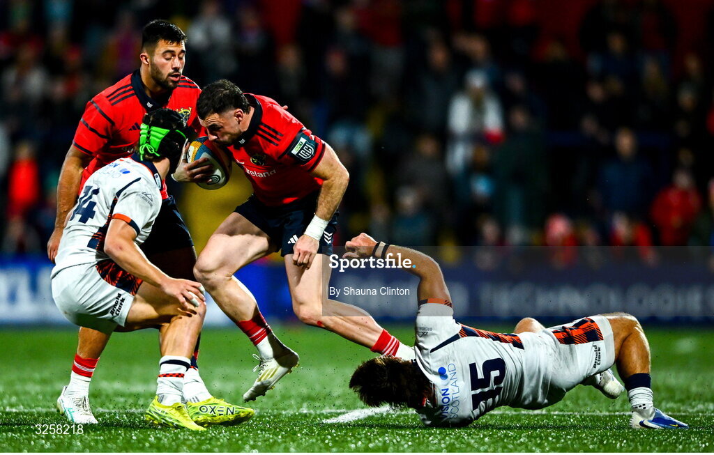 10 October 2025; Andrew Smith of Munster evades the tackle of Wes Goosen of Edinburgh during the United Rugby Championship match between Munster and Edinburgh at Virgin Media Park in Cork. Photo by Shauna Clinton/Sportsfile