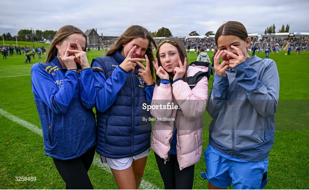 12 October 2025; Rathoth supporters, from left, Emma Kirwan, Rebecca Coulter, Skye O'Brien and Ruby Duff, at half-time during the Meath County Senior Club Football Championship final match between Ratoath and Summerhill at Páirc Tailteann in Navan, Meath. Photo by Ben McShane/Sportsfile