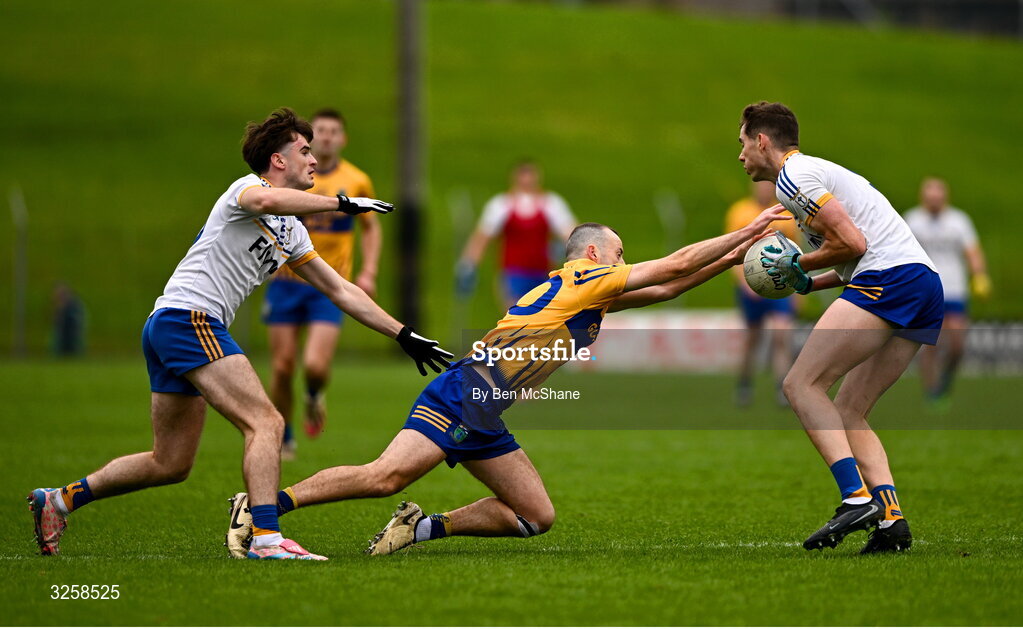 12 October 2025; Conor Lyons of Summerhill is tackled by Ronan Byrne, left, and Ben McGowan of Ratoath during the Meath County Senior Club Football Championship final match between Ratoath and Summerhill at Páirc Tailteann in Navan, Meath. Photo by Ben McShane/Sportsfile