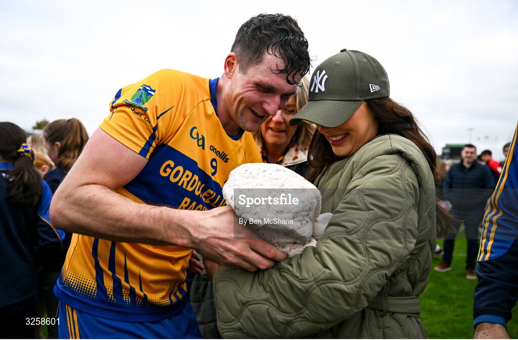 12 October 2025; Adam Flanagan of Summerhill celebrates with his partner Jennifer and 2 week old daughter Isla after the Meath County Senior Club Football Championship final match between Ratoath and Summerhill at Páirc Tailteann in Navan, Meath. Photo by Ben McShane/Sportsfile