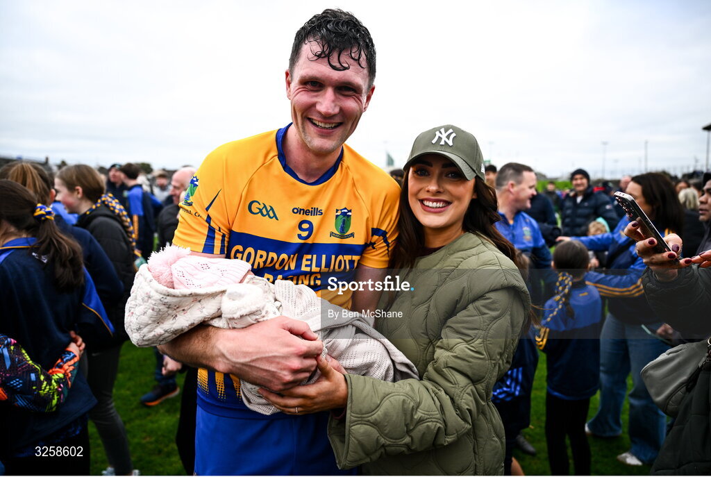 12 October 2025; Adam Flanagan of Summerhill celebrates with his partner Jennifer and 2 week old daughter Isla after the Meath County Senior Club Football Championship final match between Ratoath and Summerhill at Páirc Tailteann in Navan, Meath. Photo by Ben McShane/Sportsfile