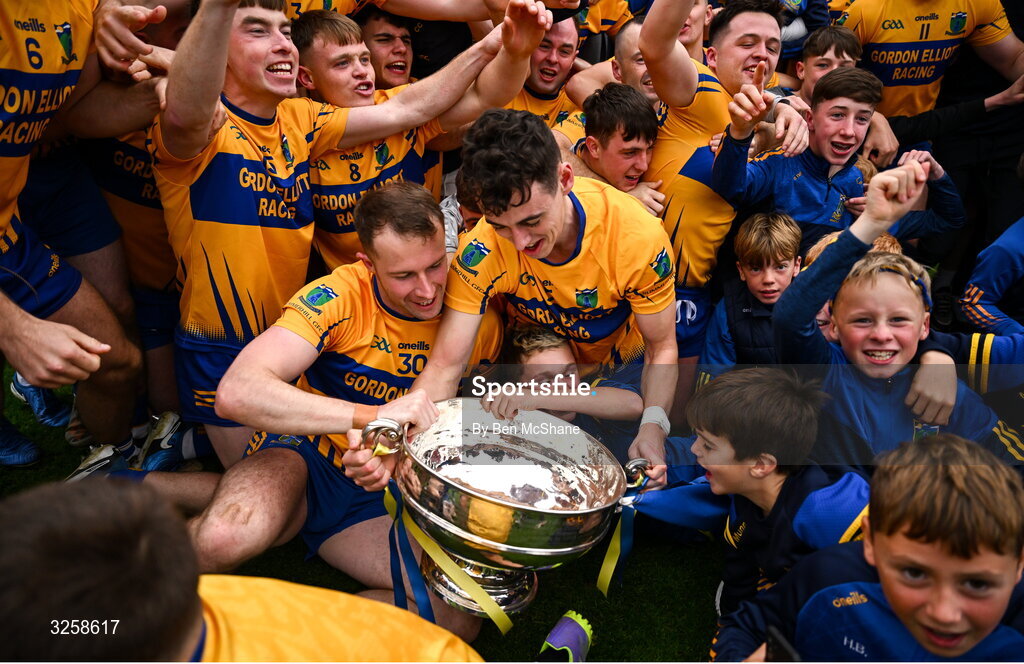 12 October 2025; Barry Tardis, left, and Jack Bannon of Summerhill celebrate with teammates and the cup after during the Meath County Senior Club Football Championship final match between Ratoath and Summerhill at Páirc Tailteann in Navan, Meath. Photo by Ben McShane/Sportsfile