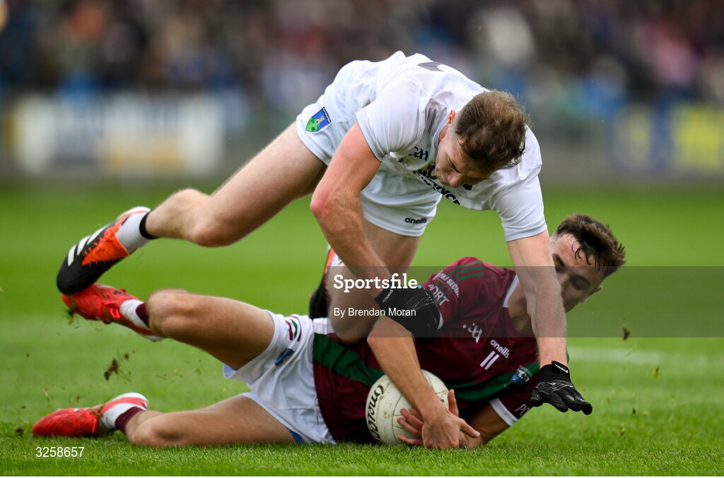 12 October 2025; Niall Dunne of Courtwood, top, competes for the ball with Ronan Coffey of Portarlington during the Laois County Senior Club Football Championship final match between Courtwood and Portarlington at Laois Hire O'Moore Park in Portlaoise, Laois. Photo by Brendan Moran/Sportsfile