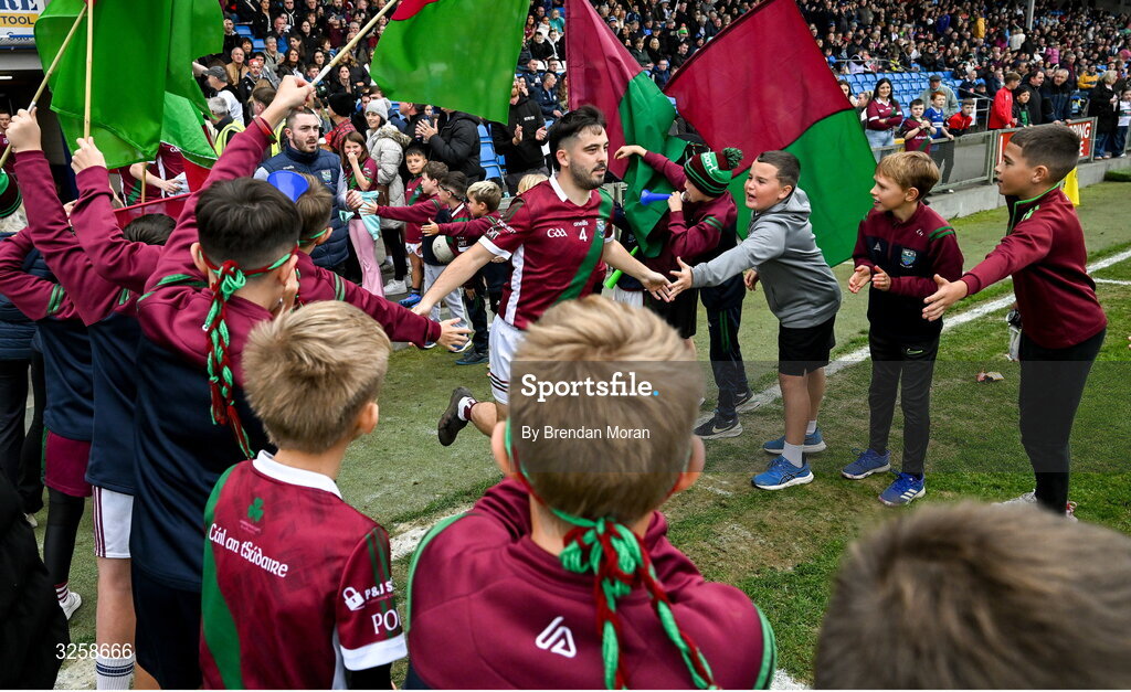 12 October 2025; Curtis Lyons of Portarlington is greeted by young Portarlington players as they run onto the pitch before the Laois County Senior Club Football Championship final match between Courtwood and Portarlington at Laois Hire O'Moore Park in Portlaoise, Laois. Photo by Brendan Moran/Sportsfile