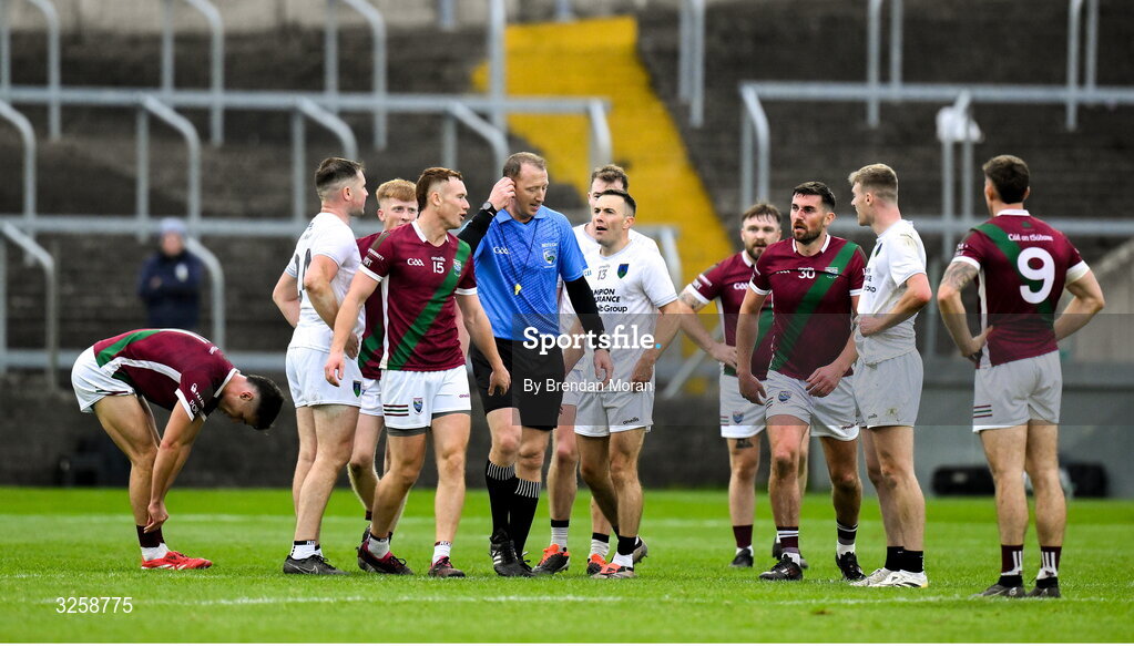12 October 2025; Players question referee Seamus Mulhare at the final whistle of the Laois County Senior Club Football Championship final match between Courtwood and Portarlington at Laois Hire O'Moore Park in Portlaoise, Laois. Photo by Brendan Moran/Sportsfile