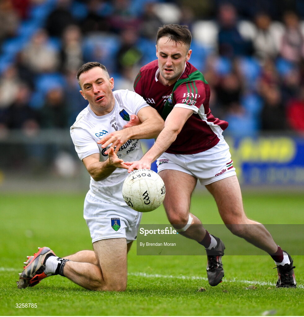 12 October 2025; Niall Donoher of Courtwood is tackled by Mikey Bennett of Portarlington during the Laois County Senior Club Football Championship final match between Courtwood and Portarlington at Laois Hire O'Moore Park in Portlaoise, Laois. Photo by Brendan Moran/Sportsfile