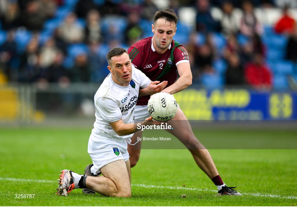 12 October 2025; Niall Donoher of Courtwood is tackled by Mikey Bennett of Portarlington during the Laois County Senior Club Football Championship final match between Courtwood and Portarlington at Laois Hire O'Moore Park in Portlaoise, Laois. Photo by Brendan Moran/Sportsfile