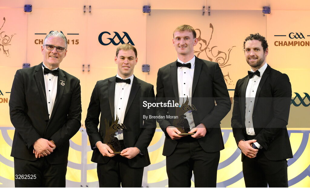17 October 2025; Kildare hurlers Cathal McCabe and James Burke, second from right, receive their 2025 Joe McDonagh Team of the Year awards from Uachtarán Chumann Lúthchleas Gael Jarlath Burns, left, and GPA Chief Executive Officer Tom Parsons during the GAA Champion 15 Awards ceremony at Croke Park in Dublin. Photo by Brendan Moran/Sportsfile