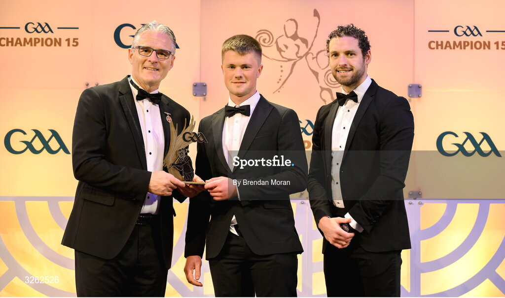 17 October 2025; Laois hurler Cathal Dunne receives his 2025 Joe McDonagh Team of the Year award from Uachtarán Chumann Lúthchleas Gael Jarlath Burns, left, and GPA Chief Executive Officer Tom Parsons during the GAA Champion 15 Awards ceremony at Croke Park in Dublin. Photo by Brendan Moran/Sportsfile