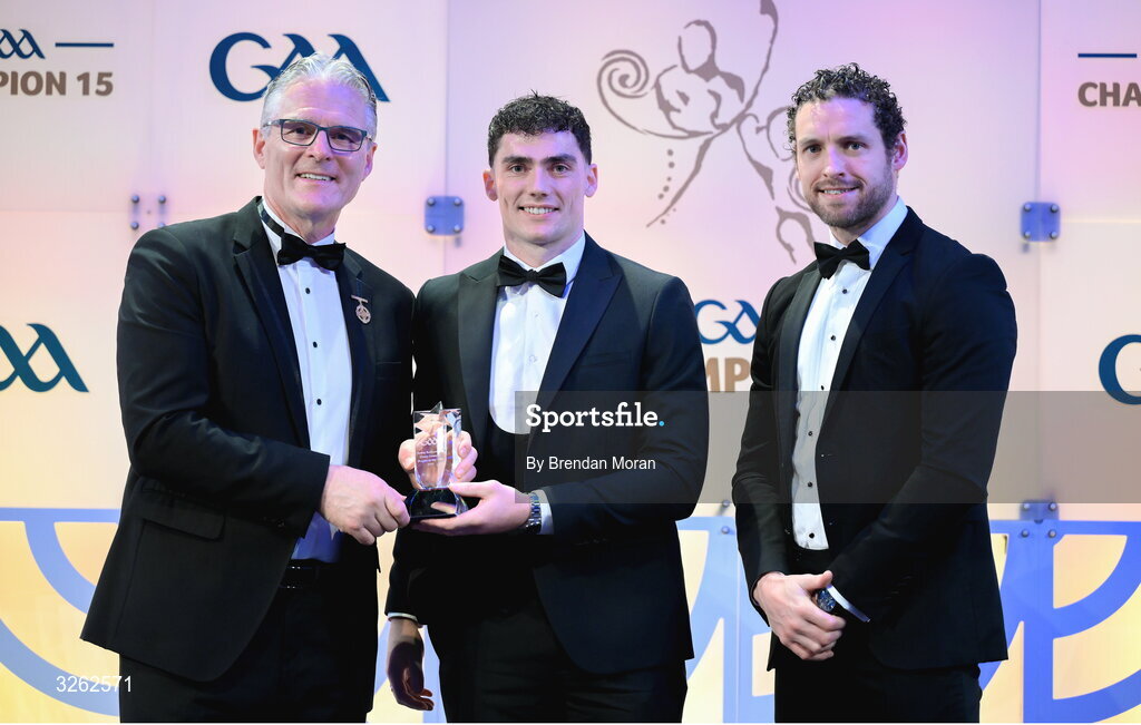 17 October 2025; Nickey Rackard Cup Player of the Year Conor Cosgrove of Roscommon is presented with his award by Uachtarán Chumann Lúthchleas Gael Jarlath Burns and GPA Chief Executive Officer Tom Parsons, right, during the GAA Champion 15 Awards ceremony at Croke Park in Dublin. Photo by Brendan Moran/Sportsfile