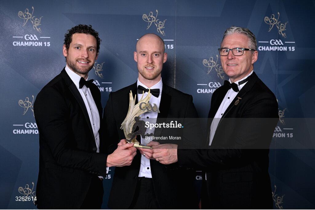 17 October 2025; Fermanagh footballer Lee Cullen receives his 2025 Tailteann Cup Team of the Year award from GPA Chief Executive Officer Tom Parsons, left, and Uachtarán Chumann Lúthchleas Gael Jarlath Burns during the GAA Champion 15 Awards ceremony at Croke Park in Dublin. Photo by Brendan Moran/Sportsfile