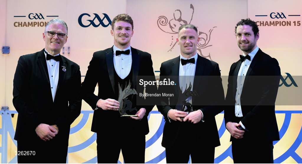 17 October 2025; Uachtarán Chumann Lúthchleas Gael Jarlath Burns, left, and GPA Chief Executive Officer Tom Parsons, right, present Kildare footballer Kevin Feely, second from left, and Wicklow footballer Dean Healy with their Tailteann Cup Team of the Year Awards during the GAA Champion 15 Awards ceremony at Croke Park in Dublin. Photo by Brendan Moran/Sportsfile