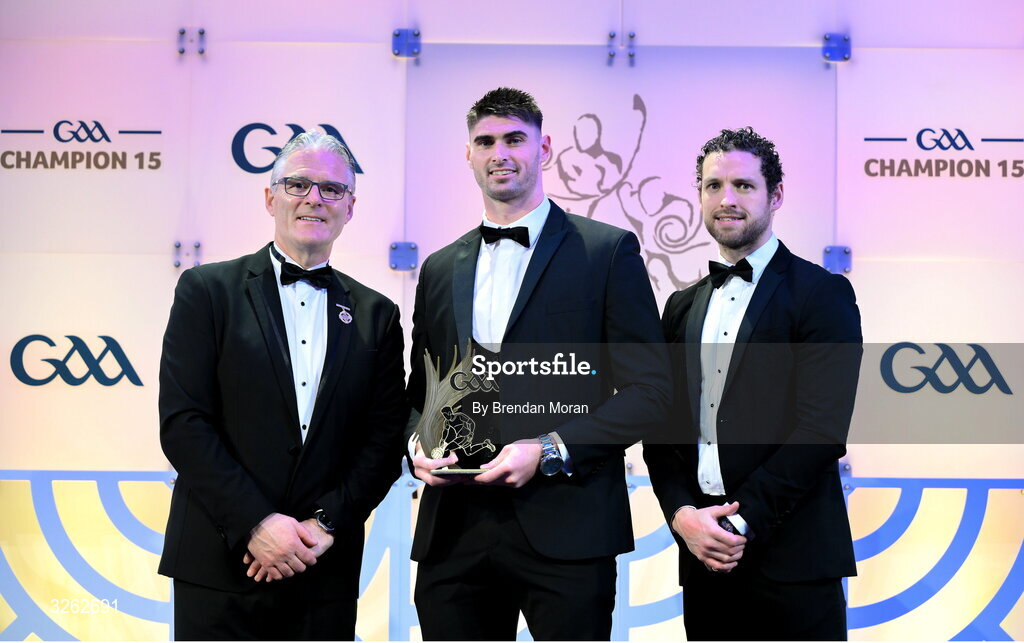 17 October 2025; Uachtarán Chumann Lúthchleas Gael Jarlath Burns, left, and GPA Chief Executive Officer Tom Parsons, right, present Limerick footballer Josh Ryan with his Tailteann Cup Team of the Year Award during the GAA Champion 15 Awards ceremony at Croke Park in Dublin. Photo by Brendan Moran/Sportsfile