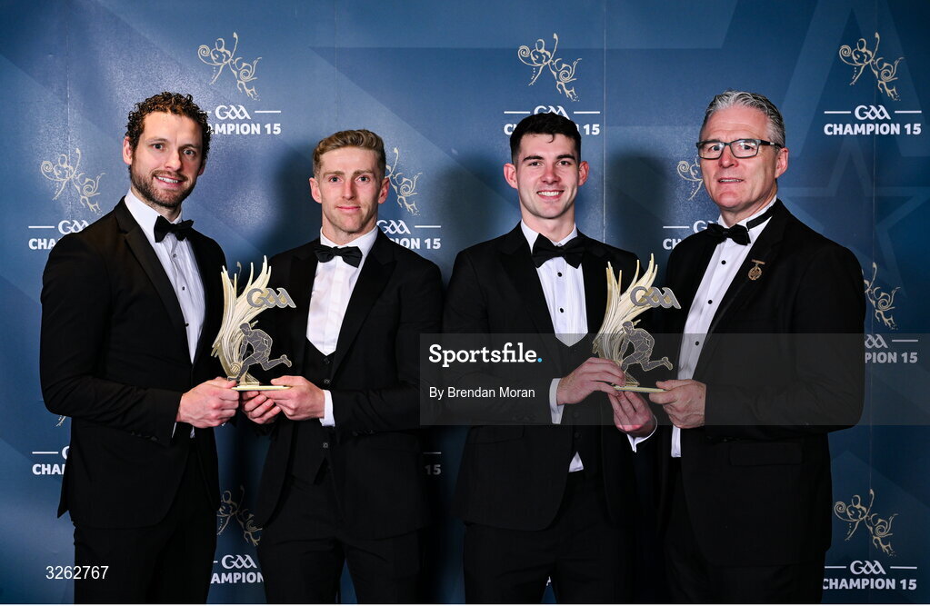 17 October 2025; Westmeath footballers Luke Loughlin and Sam McCartan, second from right, receive their 2025 Tailteann Cup Team of the Year awards from GPA Chief Executive Officer Tom Parsons, left, and Uachtarán Chumann Lúthchleas Gael Jarlath Burns, right, during the GAA Champion 15 Awards ceremony at Croke Park in Dublin. Photo by Brendan Moran/Sportsfile