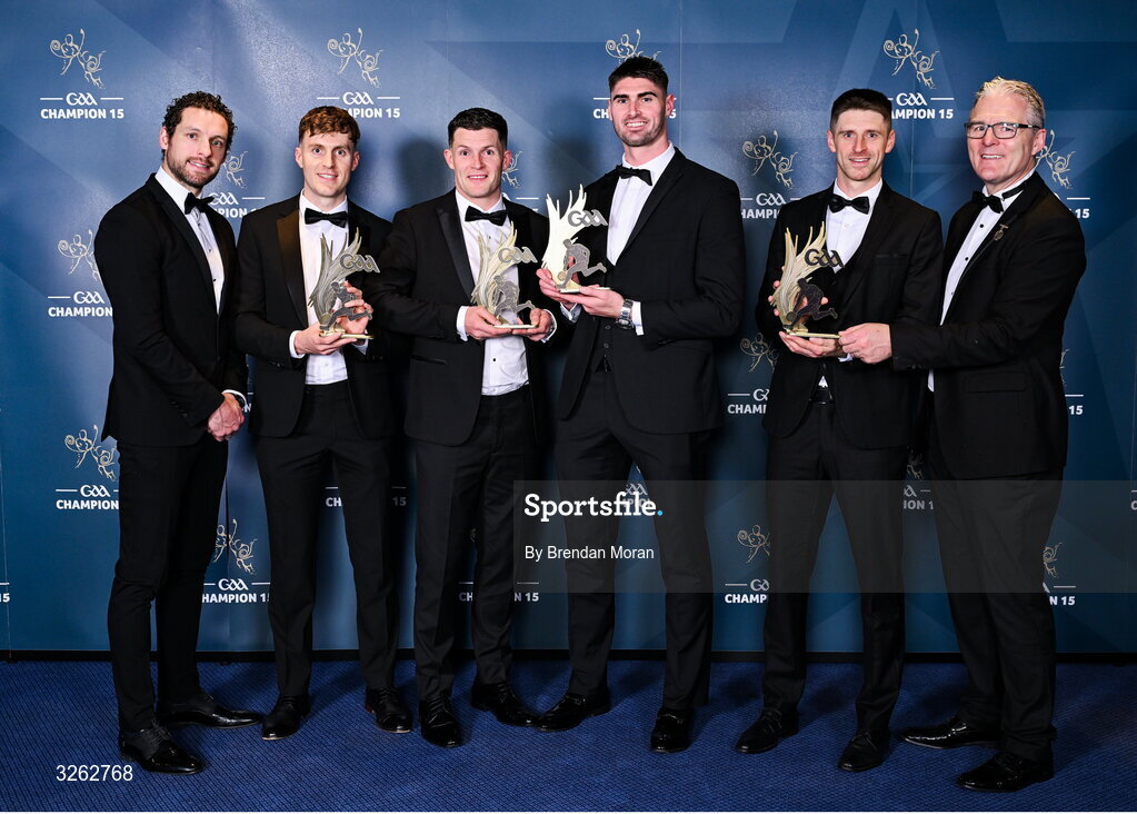 17 October 2025; Lmerick footballers, from second from left; James Naughton, Iain Corbett Josh Ryan and Danny Neville receive their 2025 Tailteann Cup Team of the Year awards from GPA Chief Executive Officer Tom Parsons, left, and Uachtarán Chumann Lúthchleas Gael Jarlath Burns, right, during the GAA Champion 15 Awards ceremony at Croke Park in Dublin. Photo by Brendan Moran/Sportsfile