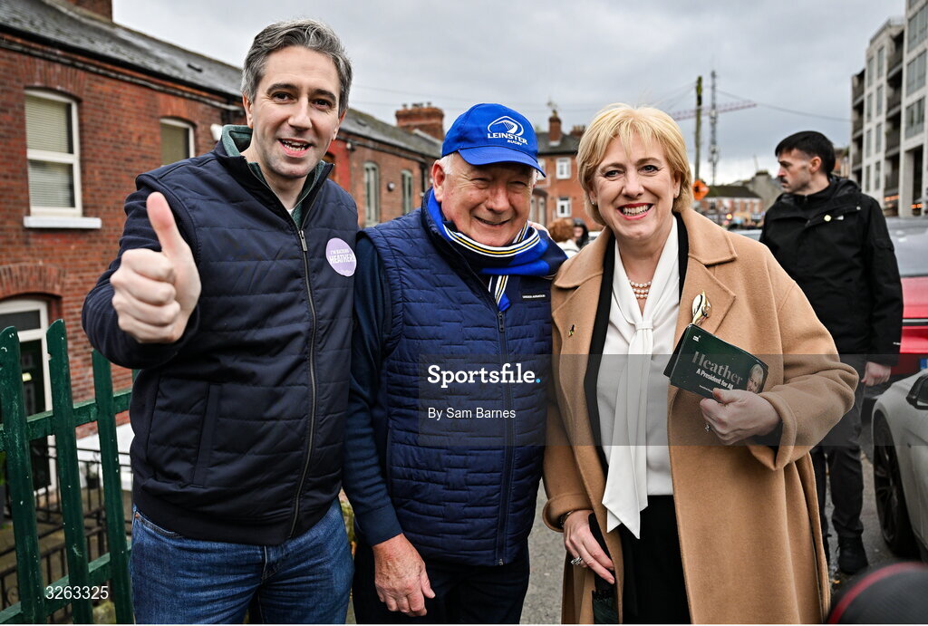 18 October 2025; Fine Gael presidential candidate Heather Humphreys, right, and Tánaiste Simon Harris TD, left, with Leinster supporter Dermot Kenny from Enniskerry, Wicklow, before the United Rugby Championship match between Leinster and Munster at Croke Park in Dublin. Photo by Sam Barnes/Sportsfile
