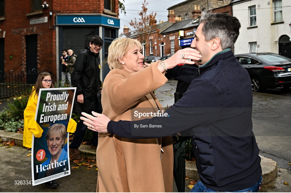 18 October 2025; Fine Gael presidential candidate Heather Humphreys, left, is greeted by Tánaiste Simon Harris TD before the United Rugby Championship match between Leinster and Munster at Croke Park in Dublin. Photo by Sam Barnes/Sportsfile